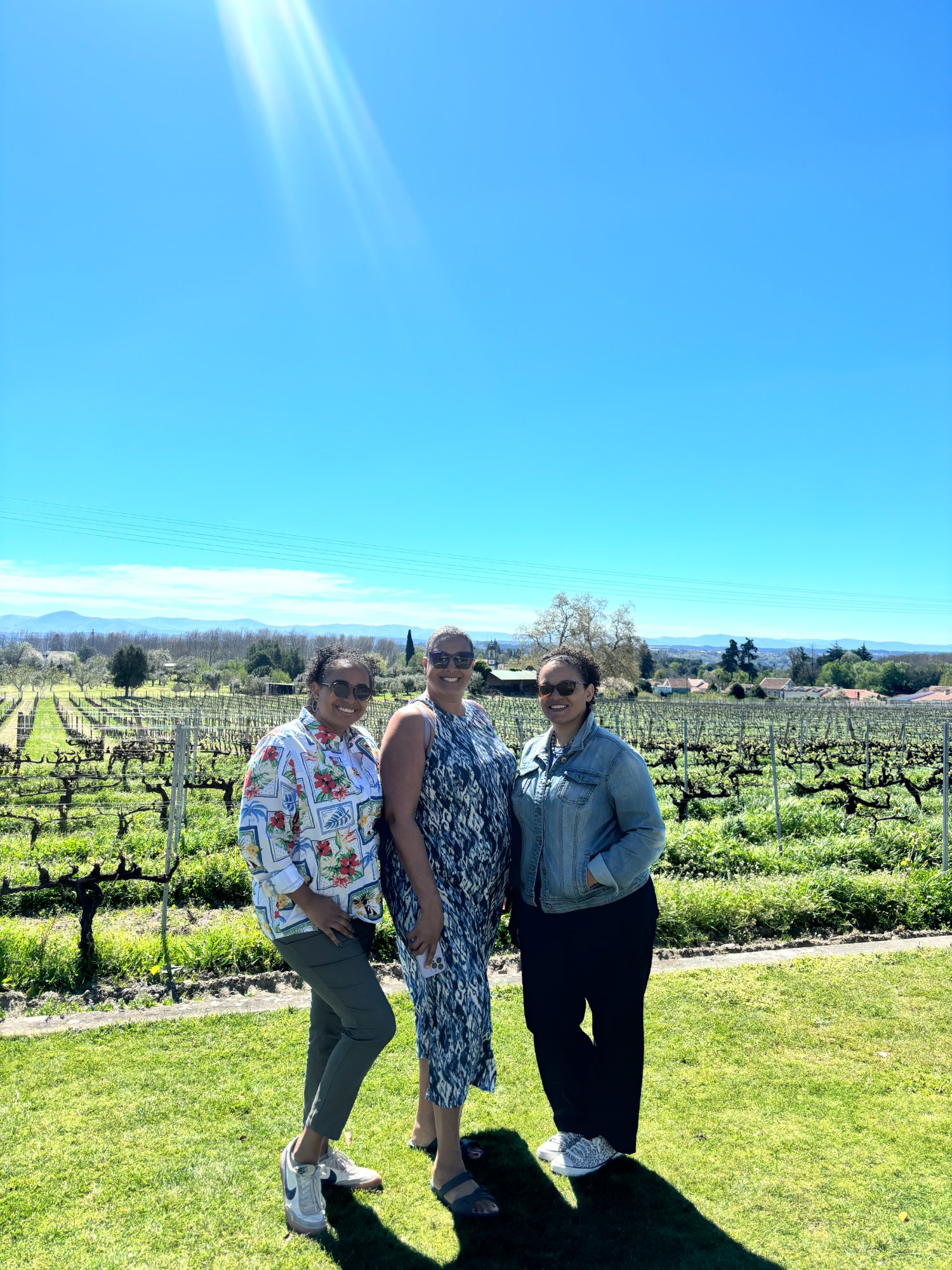 Jamaica and friends in the Dão vineyards on a sunny day